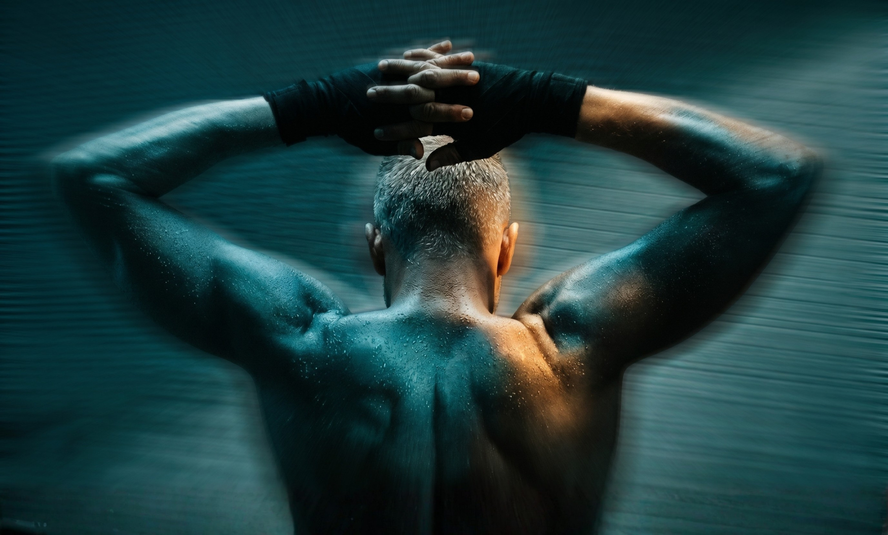Man training with focus representing muscle peptide care at BioDesign Clinic